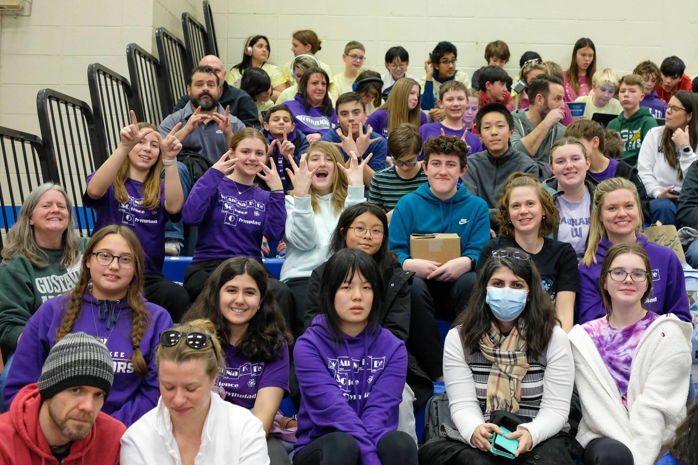 waunakee science olympiad team sitting on bleachers