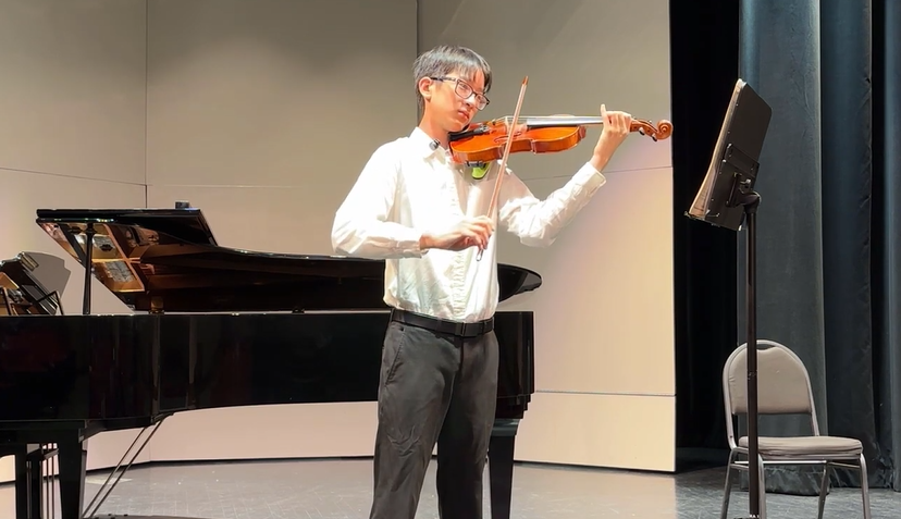 asian male playing violin