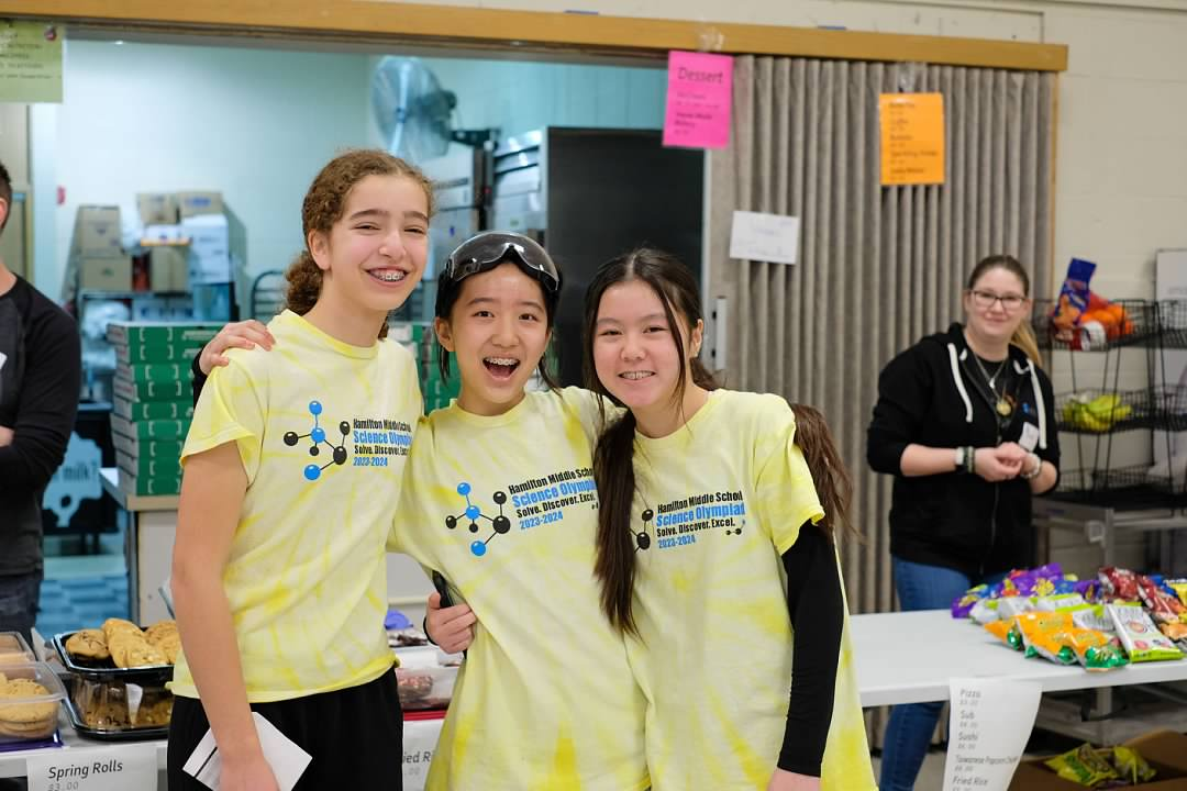 happy students standing together near concessions stand