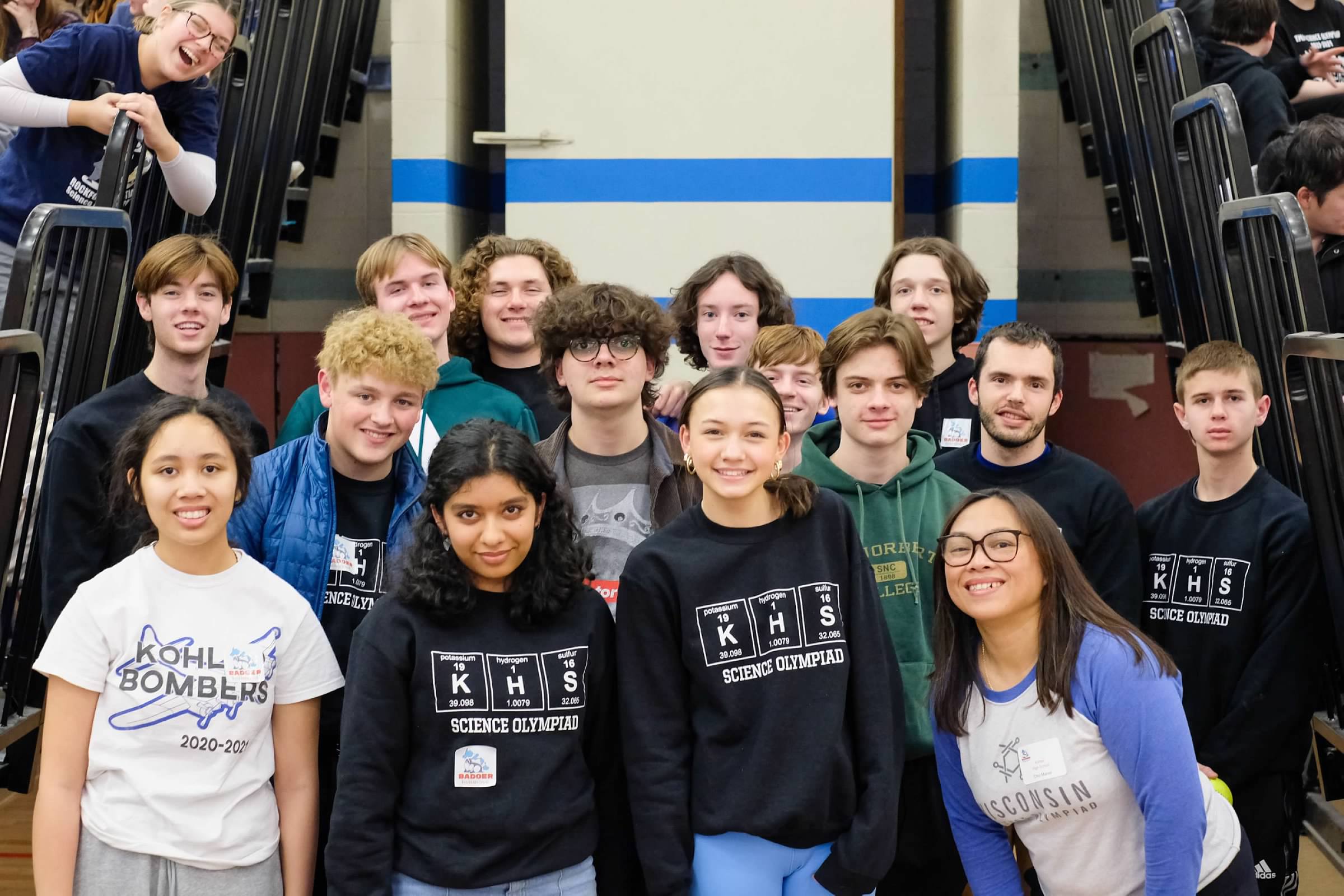 happy students standing together near concessions stand